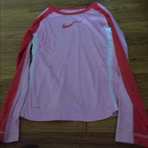 A pink and red, cozy and snug, dry-fit shirt.